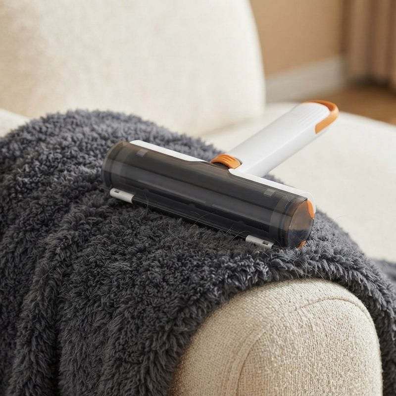 Pet hair remover roller collecting dog hair from fabric